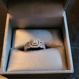 engagement ring with wedding bands. barely worn